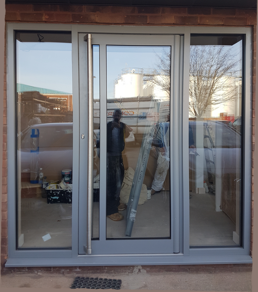 Thermal Commercial Door With Stainless Pole Handles.